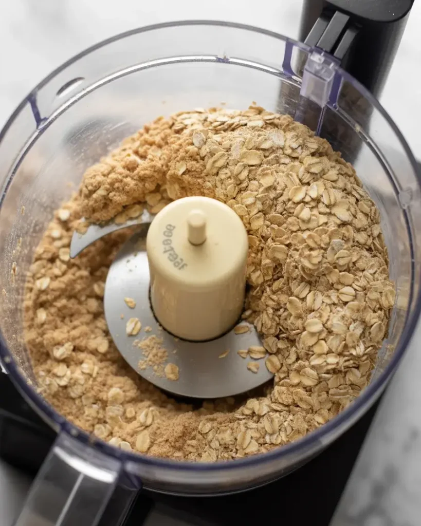 Oats pulsed to coarse crumbs in food processor for perfect crust texture