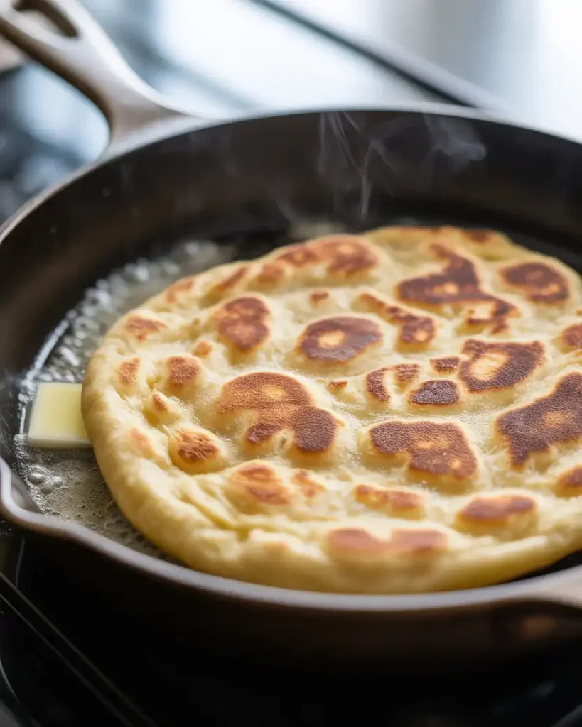 Cooking toastul in a hot skillet until golden brown spots form on both sides