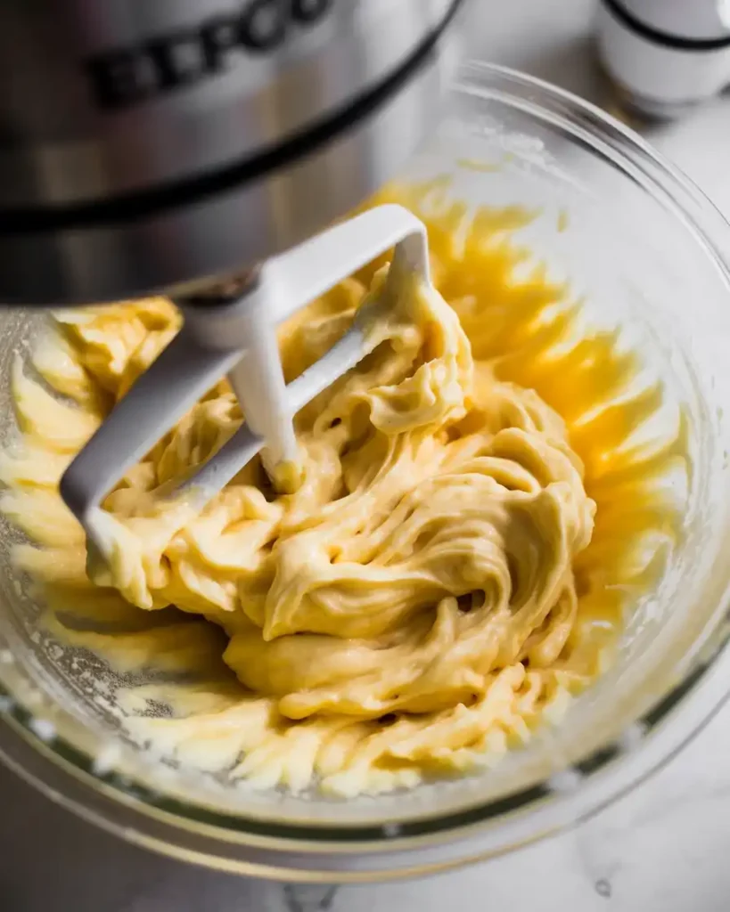 Beating butter and sugars until light and fluffy for the perfect cookie dough base