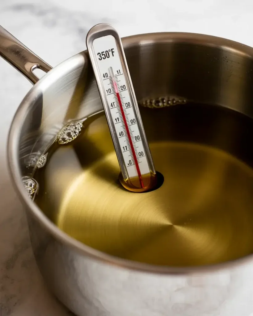Oil heated to exactly 350°F for perfect golden crispy egg rolls