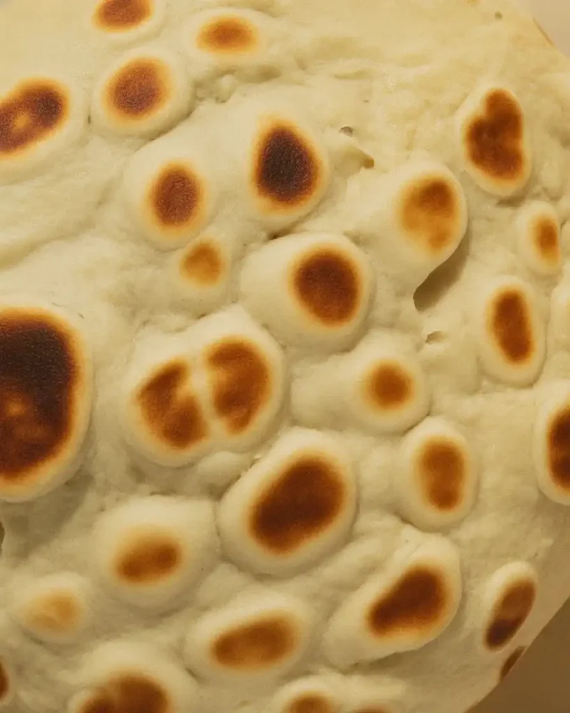 Perfect golden leopard spots formed from high heat and butter during cooking