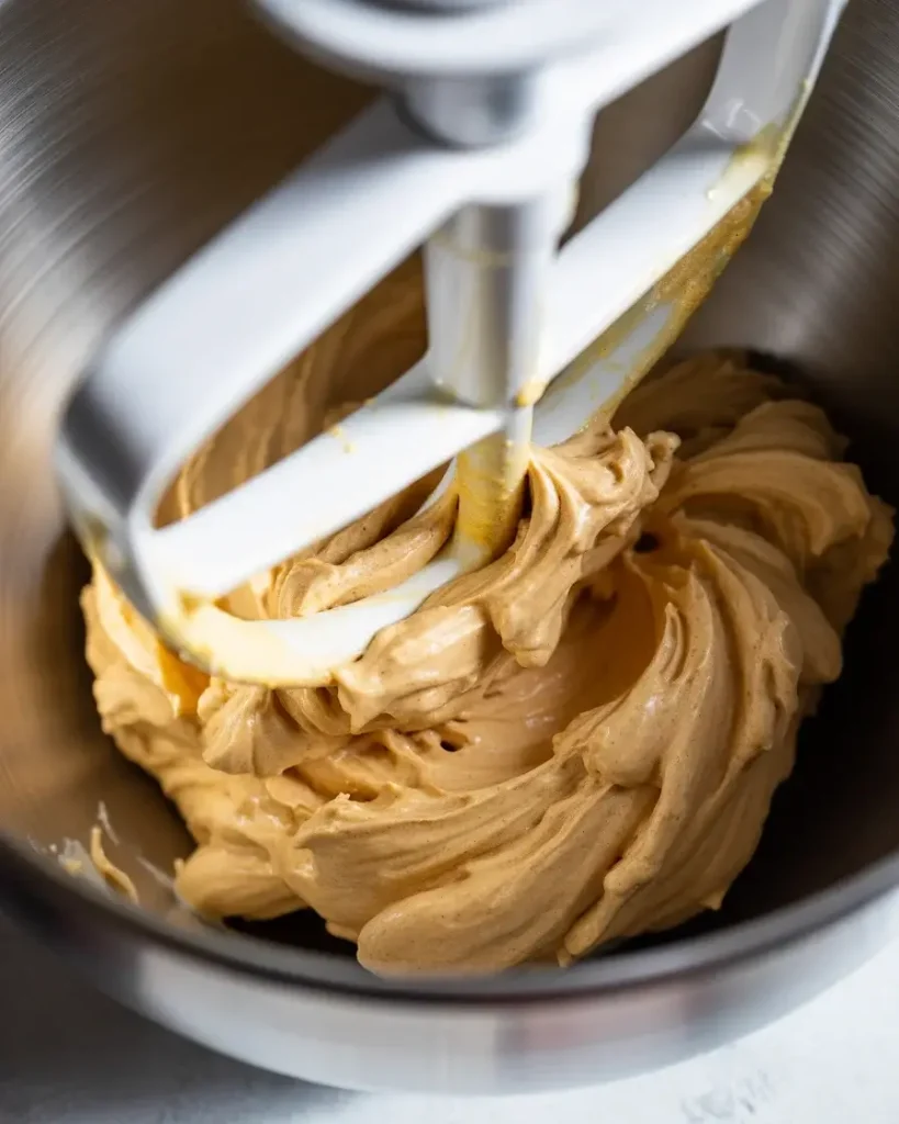 Butter and sugars creamed until fluffy and pale for perfect cookie textureButter and sugars creamed until fluffy and pale for perfect cookie texture