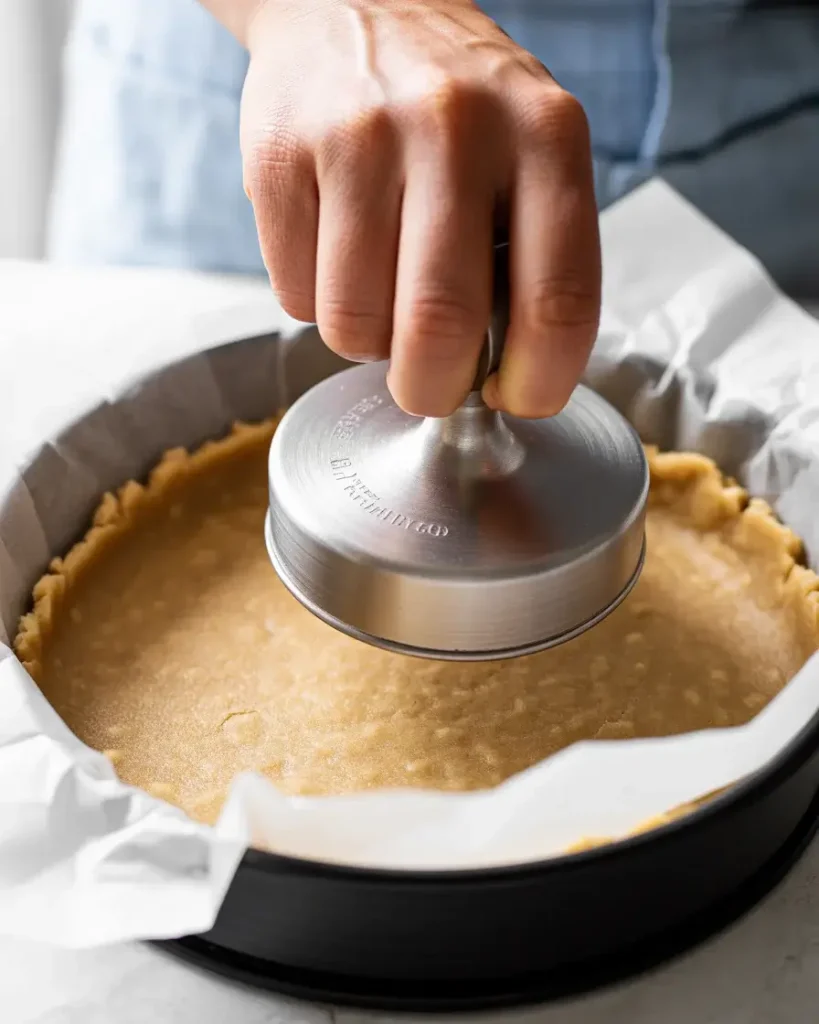 Press crust firmly with measuring cup for sturdy base