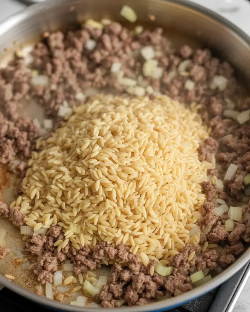 Toast dry orzo 60-90 seconds until nutty golden - don't skip this step