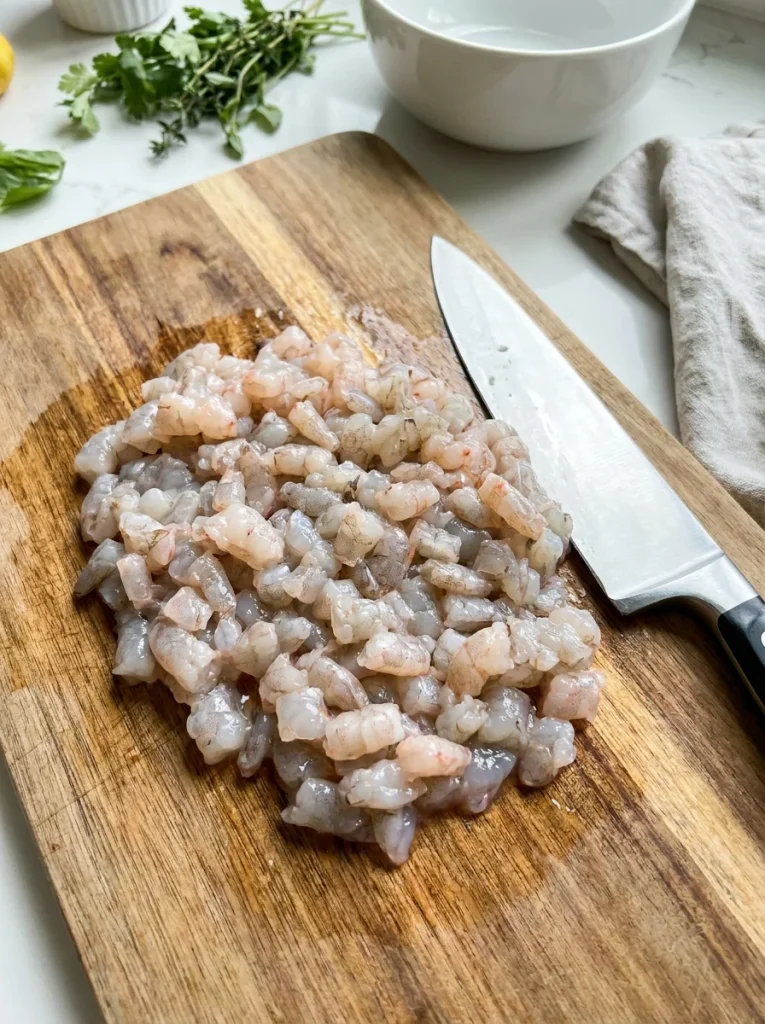 Finely chop shrimp into small pieces for an even, creamy wonton filling