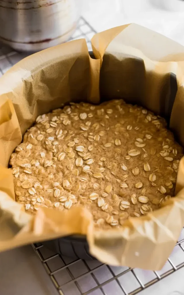 Pre-baked oat crust layer golden at the edges and ready for toppings